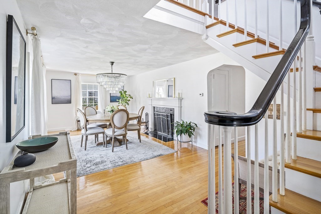 28 Longmeadow Road Arlington, MA 02474 - Photo 2 of 25 a living room with furniture a fireplace and a table