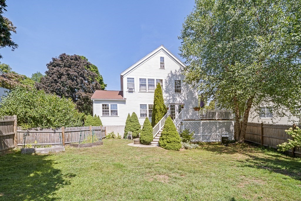 28 Longmeadow Road Arlington, MA 02474 - Photo 22 of 25 a view of a house with backyard and trees