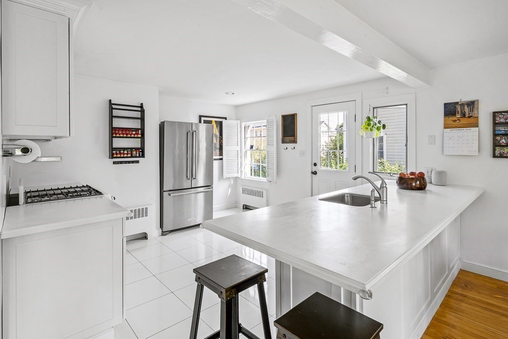 28 Longmeadow Road Arlington, MA 02474 - Photo 8 of 25 a kitchen with a appliances a refrigerator and a stove