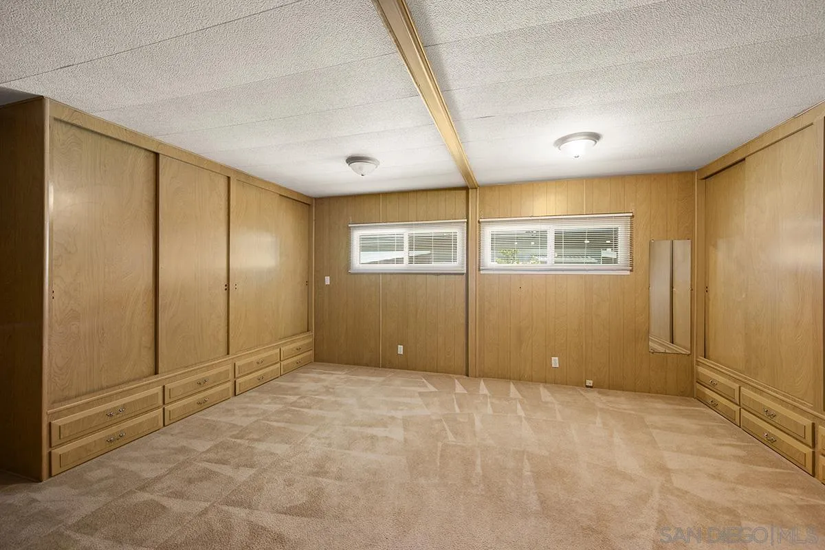 8545 Mission Gorge Road, Unit 239 Santee, CA 92071 - Photo 16 of 26 an empty room with windows and refrigerator