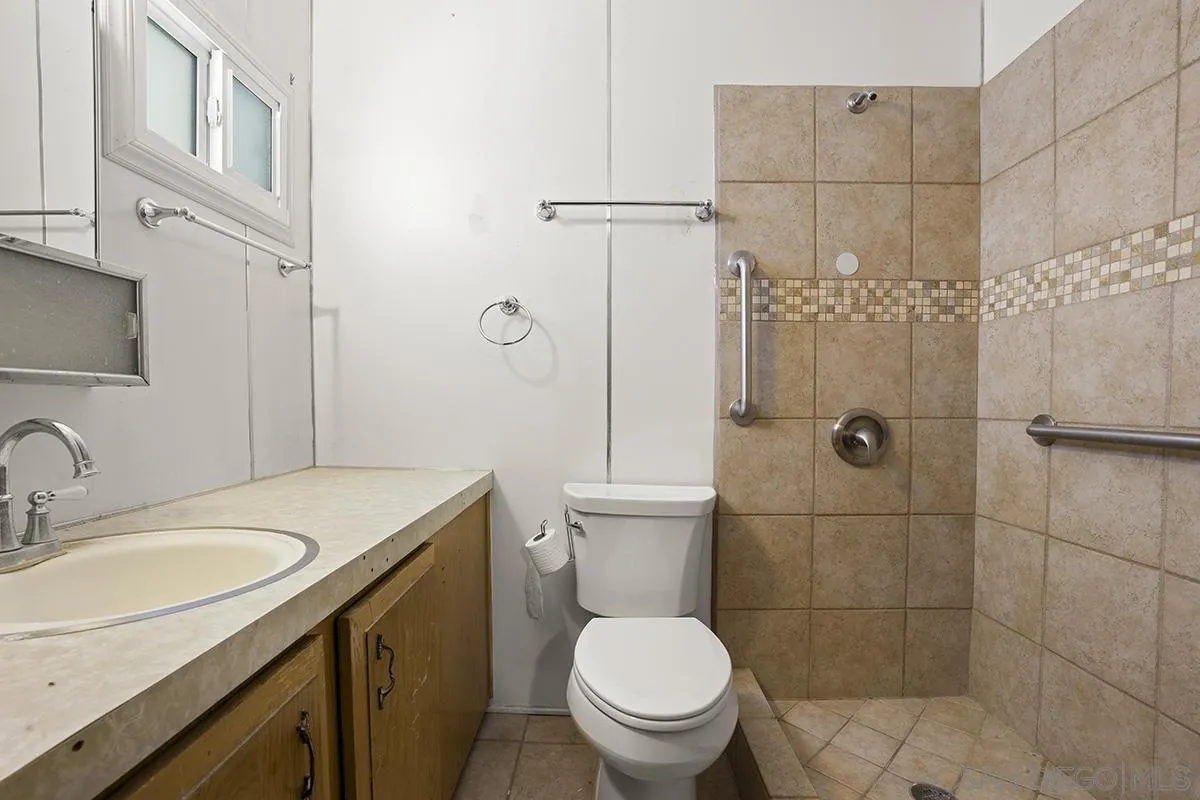 8545 Mission Gorge Road, Unit 239 Santee, CA 92071 - Photo 22 of 26 a bathroom with a sink toilet and shower