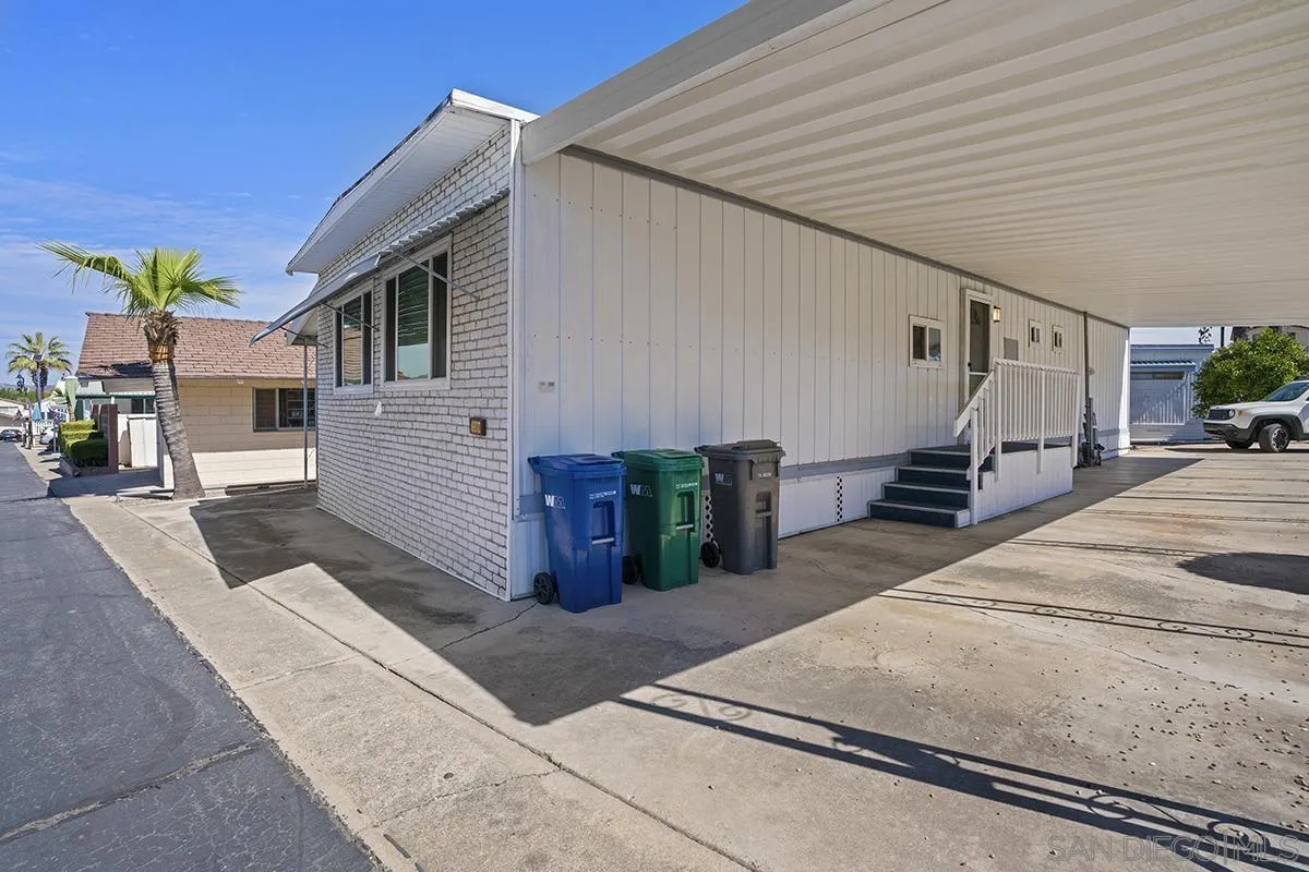 8545 Mission Gorge Road, Unit 239 Santee, CA 92071 - Photo 4 of 26 a view of a patio with table and chairs