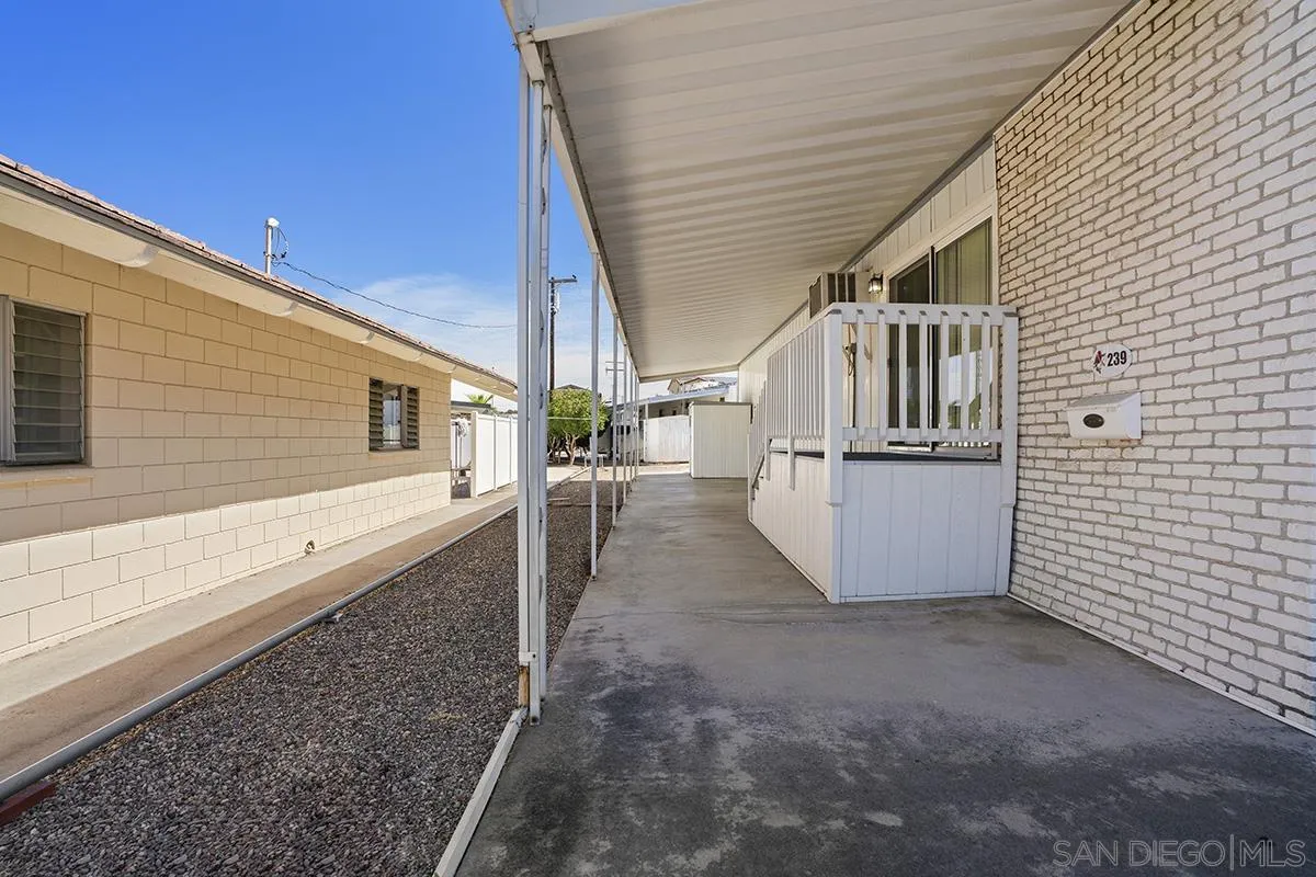 8545 Mission Gorge Road, Unit 239 Santee, CA 92071 - Photo 5 of 26 a view of a porch with wooden floor and stairs