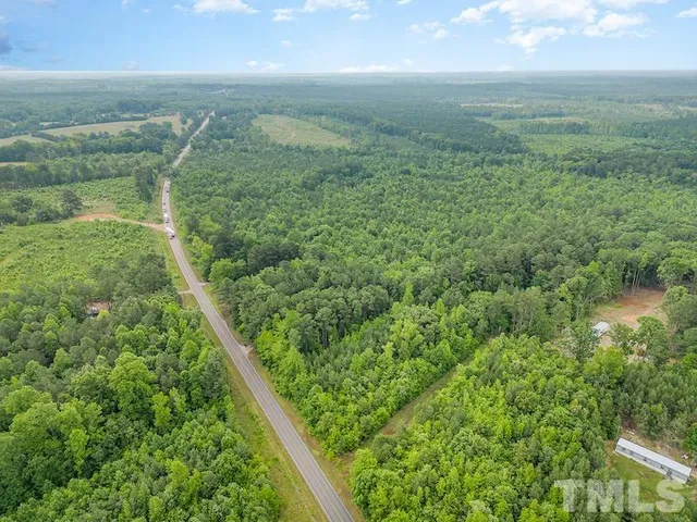 a view of a yard with an outdoor seating