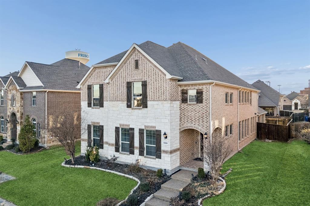 6333 Hall Road Frisco, TX 75034 - Photo 2 of 36 The house faces east and looks out to a beautiful greenbelt. Grass has been digitally enhanced.