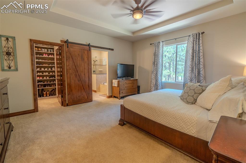 15324 Pole Pine Point Colorado Springs, CO 80908 - Photo 19 of 50 a bedroom with a bed and furniture