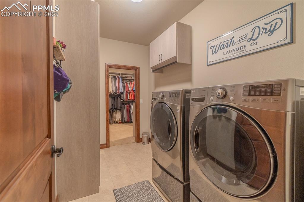 15324 Pole Pine Point Colorado Springs, CO 80908 - Photo 25 of 50 a view of a hallway with washer and dryer