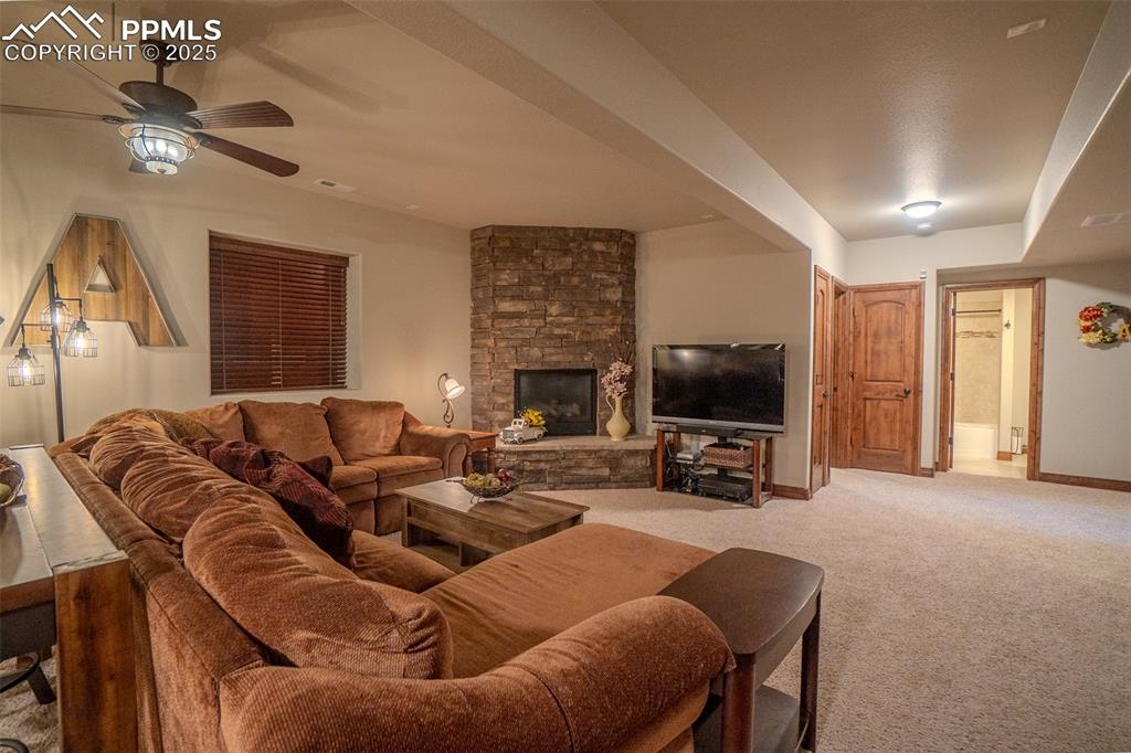 15324 Pole Pine Point Colorado Springs, CO 80908 - Photo 30 of 50 a living room with furniture and a flat screen tv