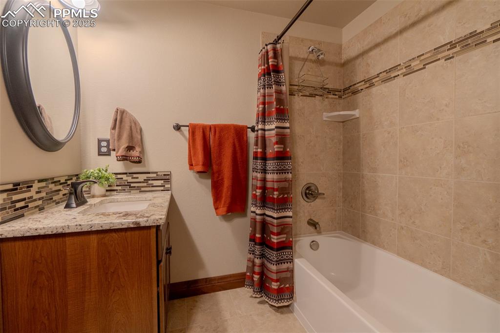 15324 Pole Pine Point Colorado Springs, CO 80908 - Photo 39 of 50 a bathroom with a tub sink and mirror