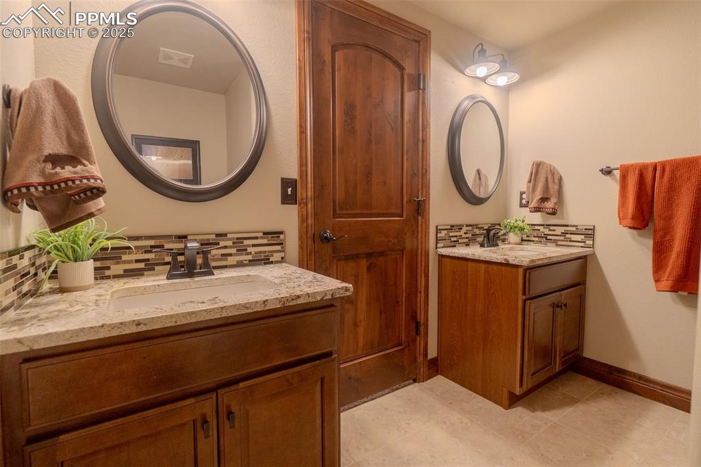 15324 Pole Pine Point Colorado Springs, CO 80908 - Photo 40 of 50 double vanity in basement full bathroom