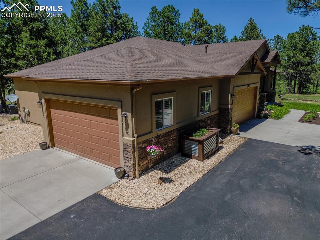 15324 Pole Pine Point Colorado Springs, CO 80908 - Photo 5 of 50 a view of a house with a patio