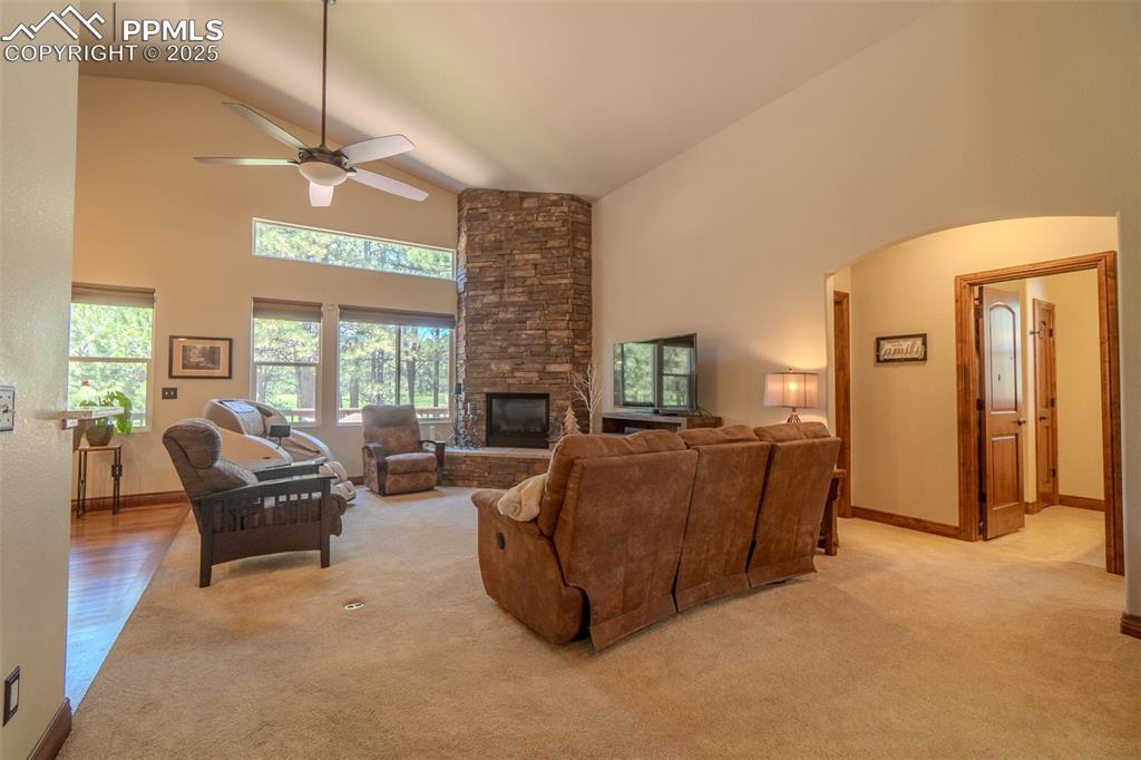 15324 Pole Pine Point Colorado Springs, CO 80908 - Photo 10 of 50 a living room with furniture and a chandelier