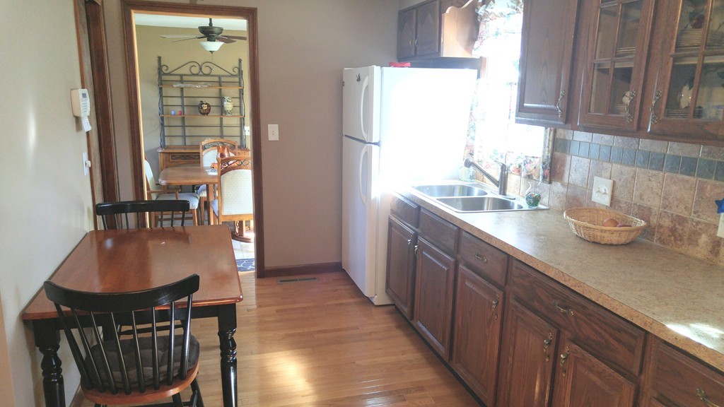80 Woodcrest Road Springfield, MA 01129 - Photo 7 of 21 a kitchen with sink cabinets and wooden floor
