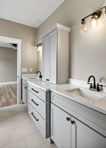 a bathroom with a sink and a mirror