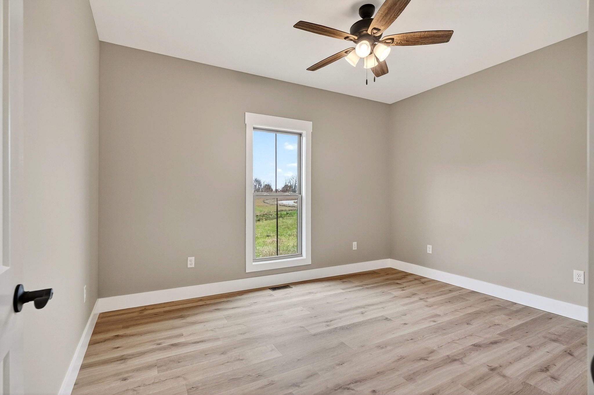 136 East McCormick Road Livingston, TN 38570 - Photo 26 of 29 wooden floor in an empty room with a window