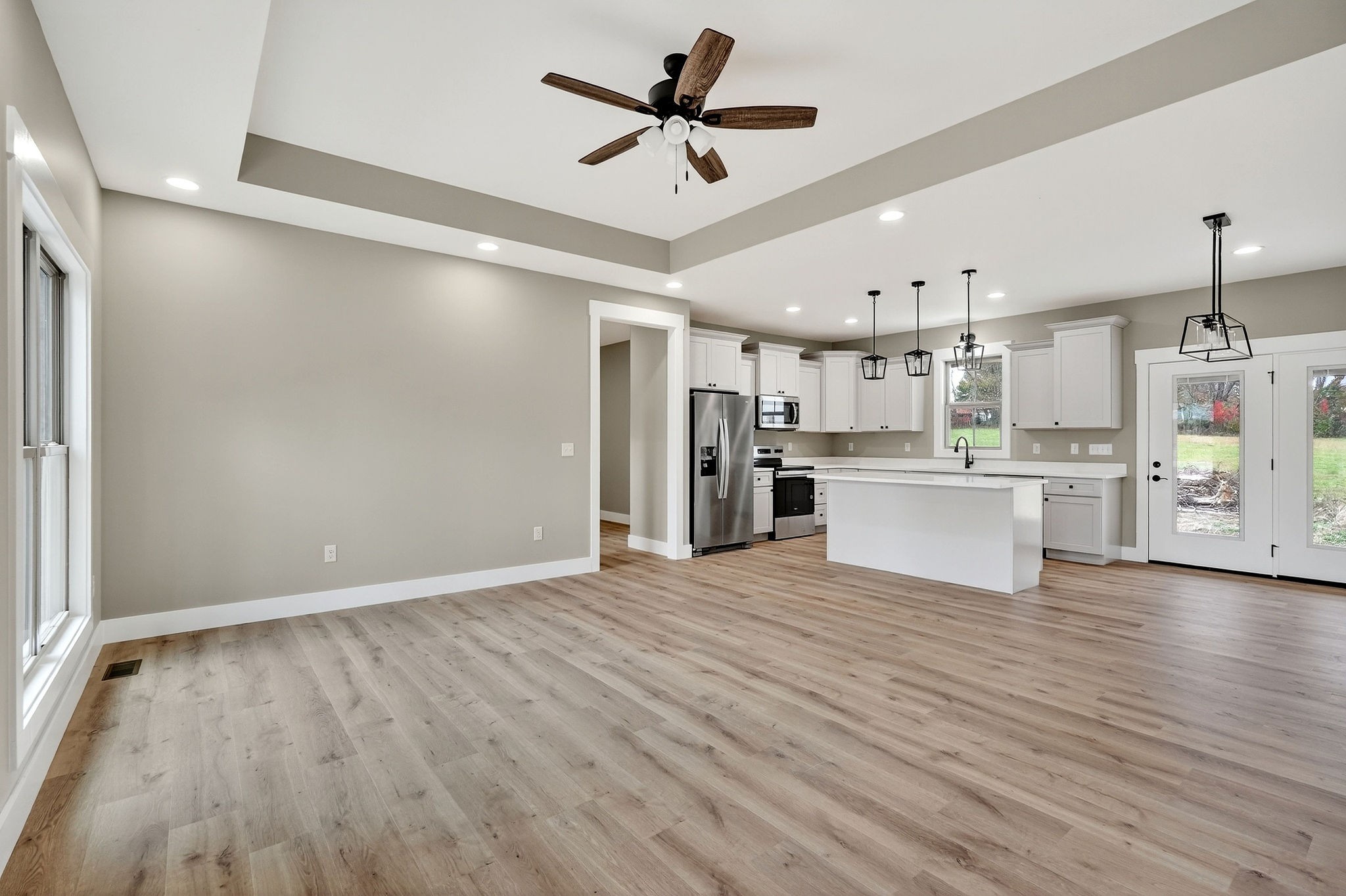 136 East McCormick Road Livingston, TN 38570 - Photo 5 of 29 a view of a kitchen with wooden floor and a ceiling fan