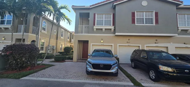 a car parked in front of a brick building