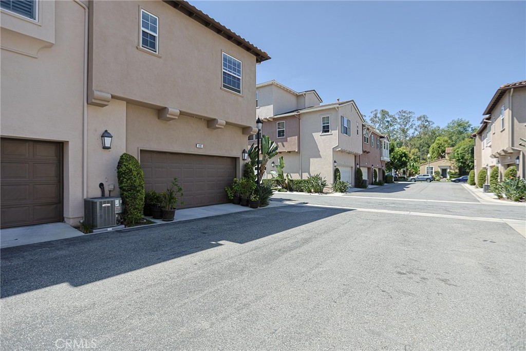416 Quail Ridge Irvine, CA 92603 - Photo 1 of 23 a view of a white house with a street