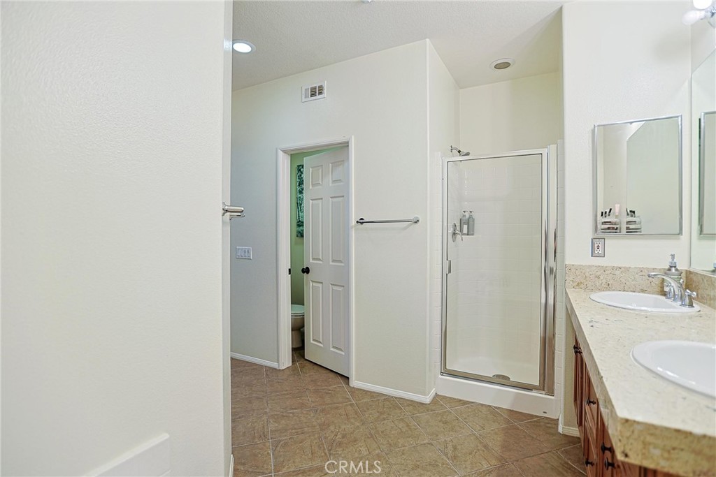 416 Quail Ridge Irvine, CA 92603 - Photo 15 of 23 a bathroom with a sink and a mirror