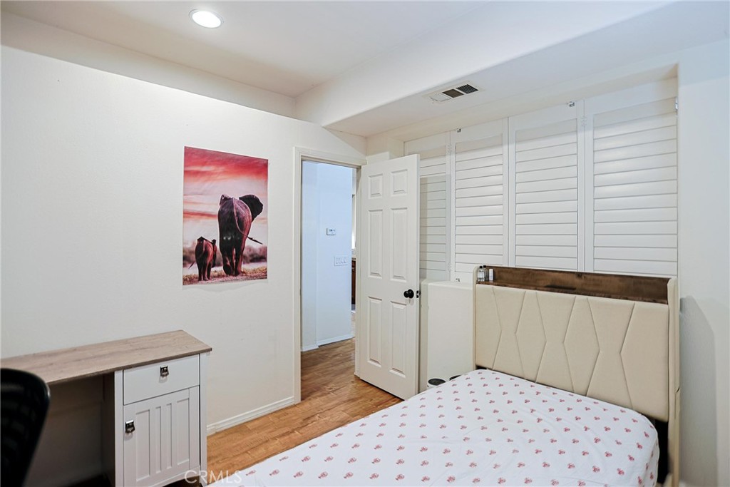 416 Quail Ridge Irvine, CA 92603 - Photo 16 of 23 a bedroom with a bed and a closet