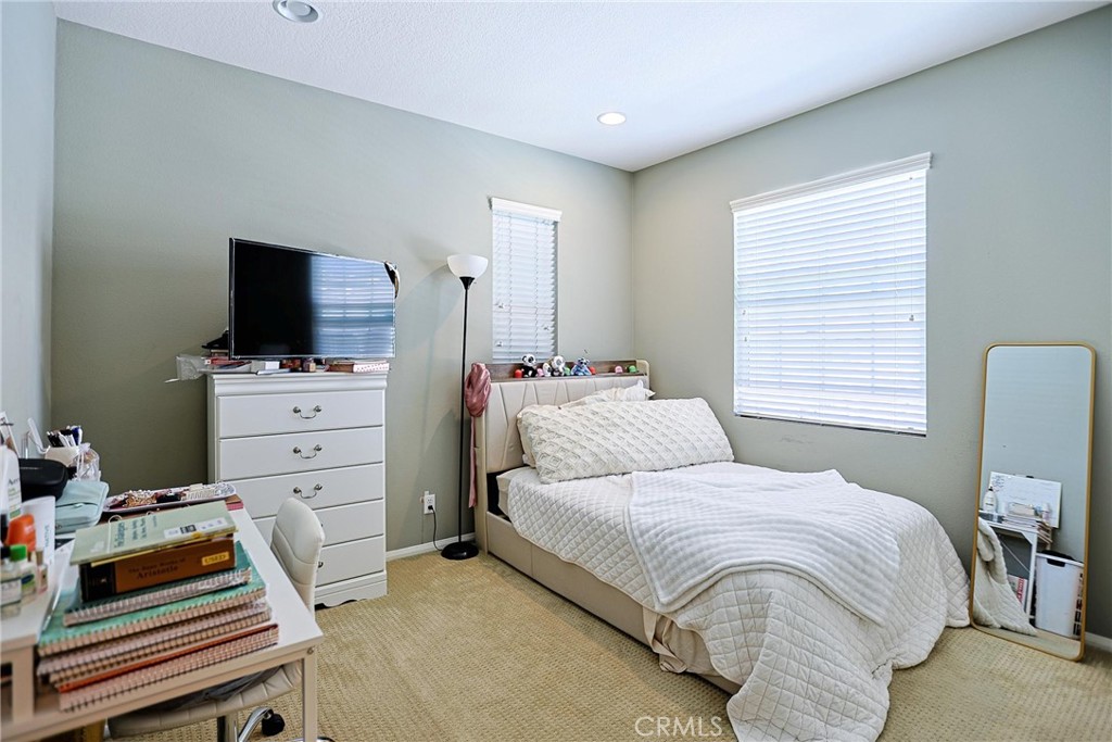 416 Quail Ridge Irvine, CA 92603 - Photo 17 of 23 a bedroom with a bed and flat screen tv