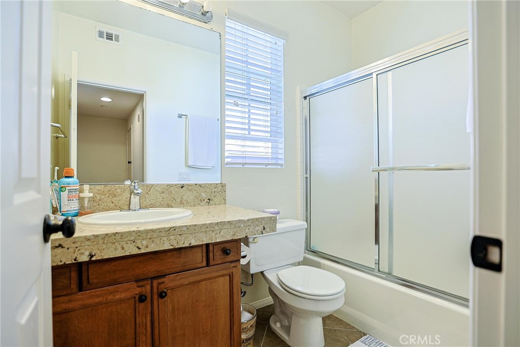 416 Quail Ridge Irvine, CA 92603 - Photo 18 of 23 a bathroom with a sink toilet and shower