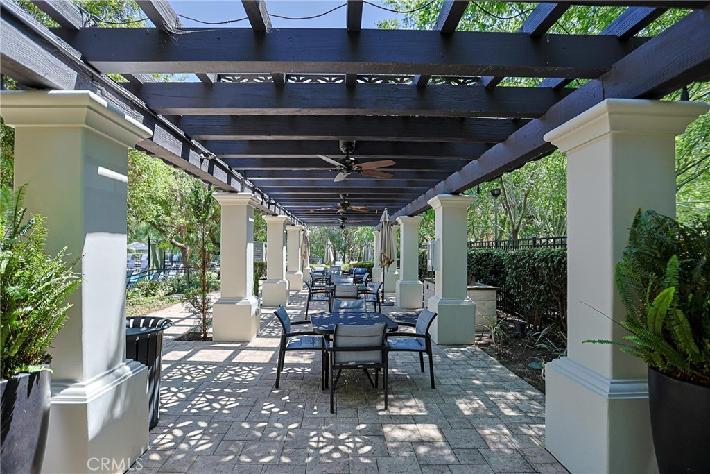 416 Quail Ridge Irvine, CA 92603 - Photo 19 of 23 a view of a porch with chairs and potted plants