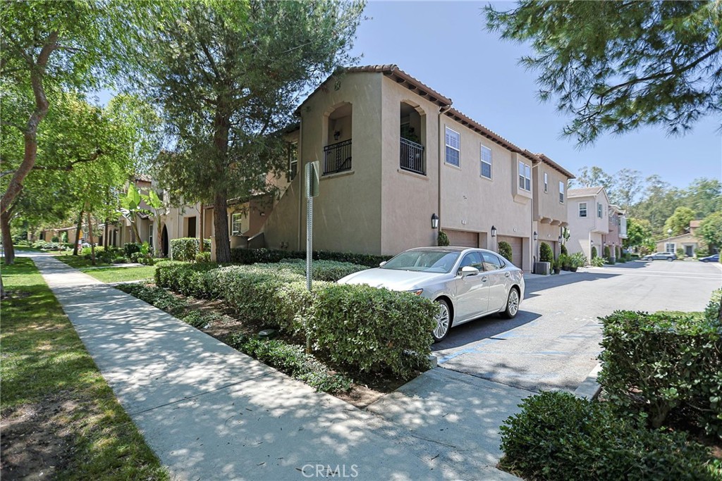 416 Quail Ridge Irvine, CA 92603 - Photo 4 of 23 a front view of a house with a yard