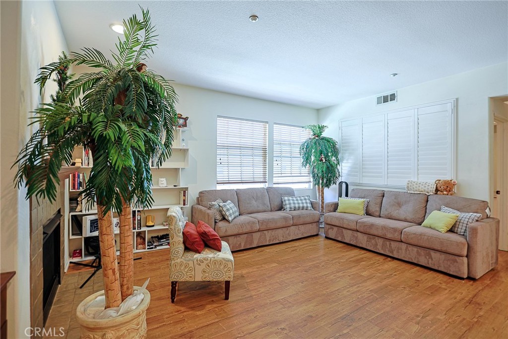 416 Quail Ridge Irvine, CA 92603 - Photo 7 of 23 a living room with furniture and a potted plant