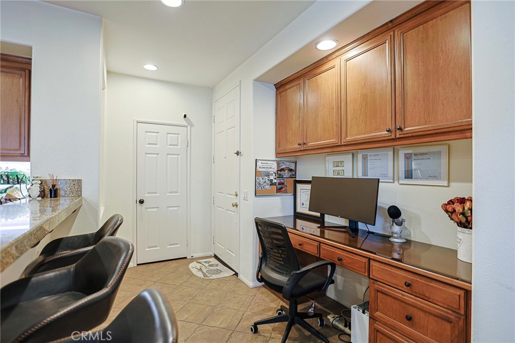 416 Quail Ridge Irvine, CA 92603 - Photo 9 of 23 a workspace with a desk chair and painted walls