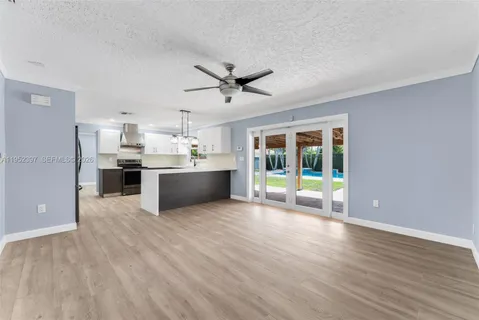 a kitchen with a refrigerator and a sink