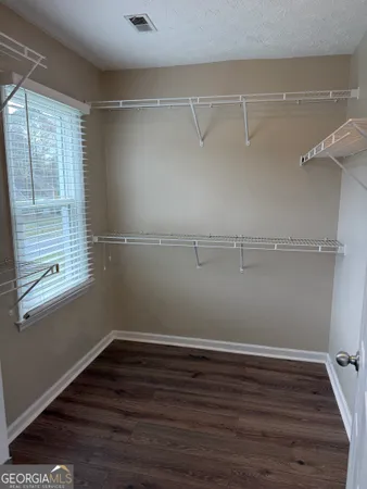 a view of a room with racks on the wall