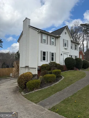 a house view with a garden space