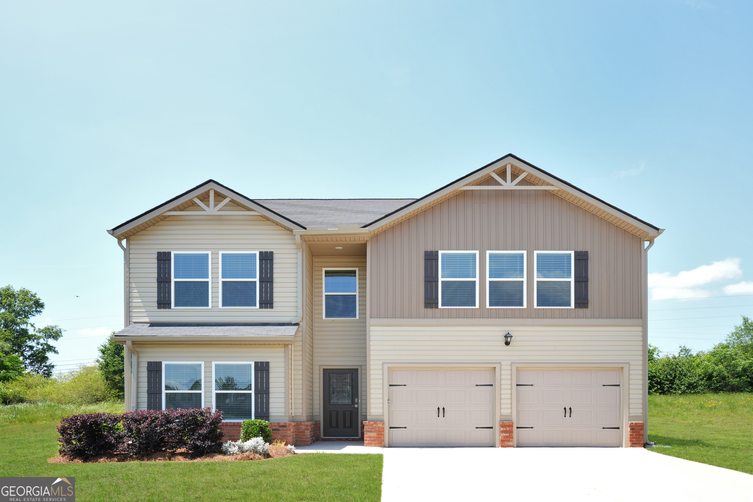 858 Clyde's Way Jackson, GA 30233 - Photo 1 of 1 a front view of a house with garden