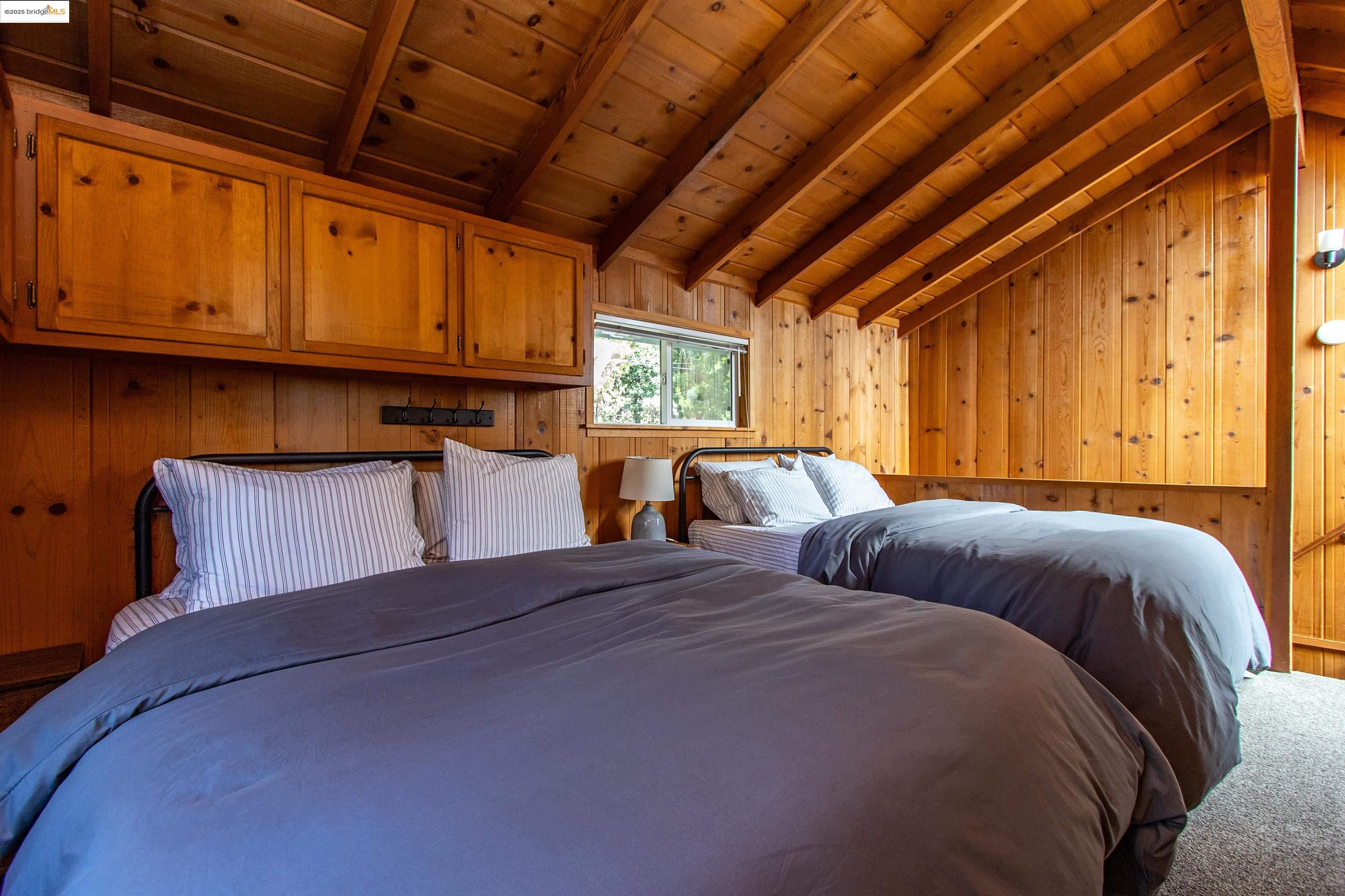 20737 Muheli Road Mi Wuk Village, CA 95346 - Photo 15 of 40 a bedroom with bed and window