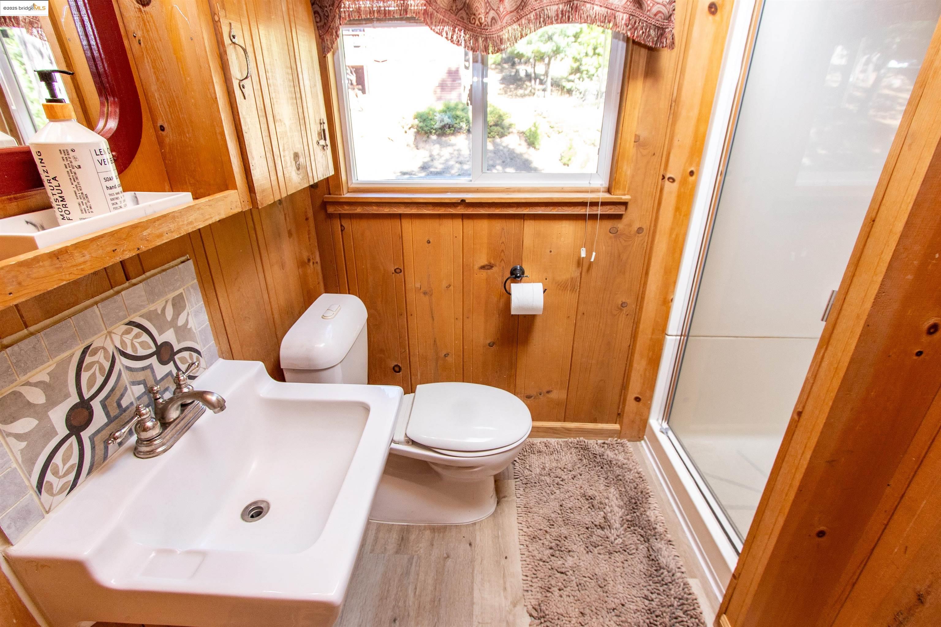 20737 Muheli Road Mi Wuk Village, CA 95346 - Photo 18 of 40 a bathroom with a sink and a toilet