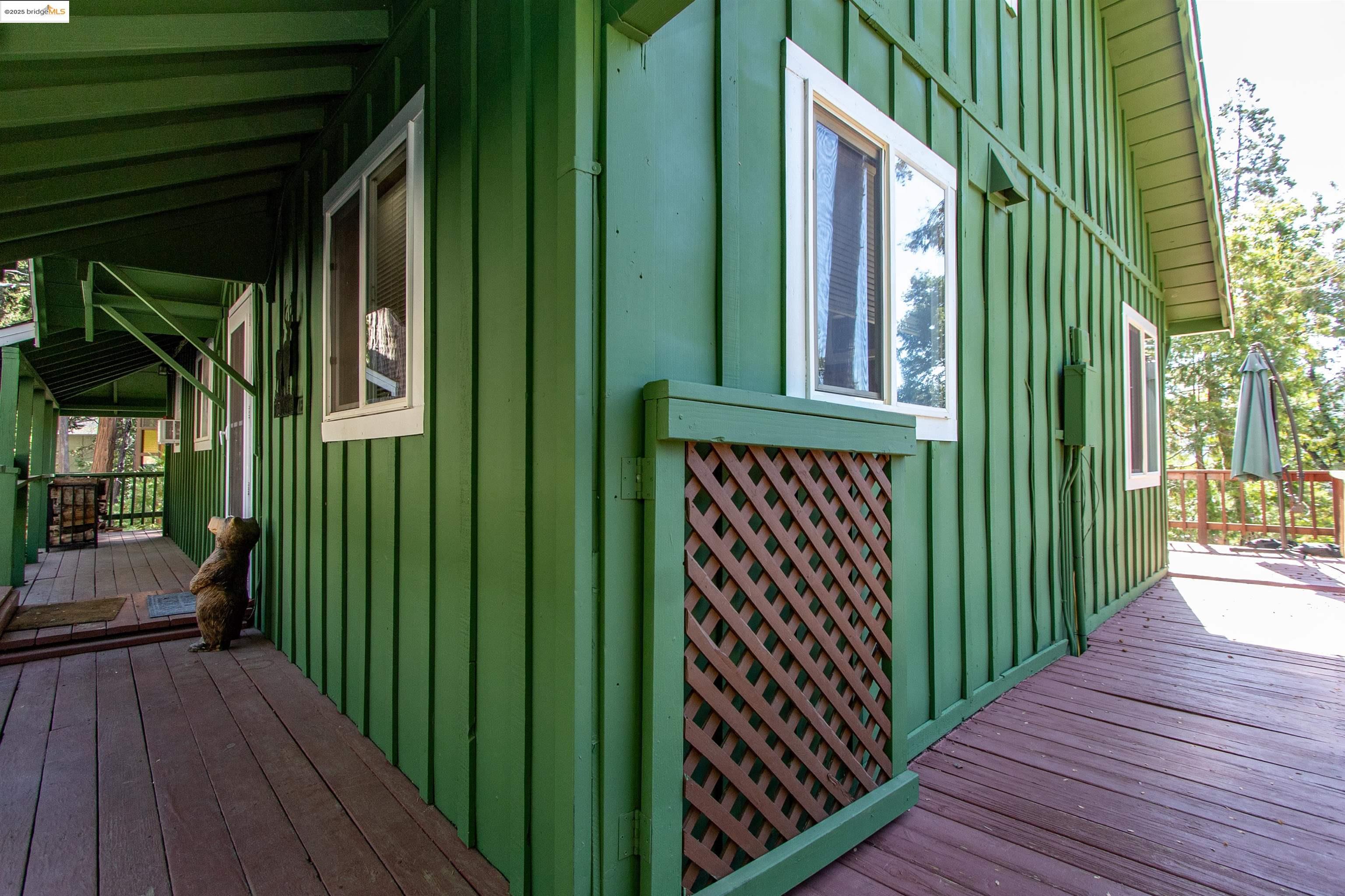 20737 Muheli Road Mi Wuk Village, CA 95346 - Photo 27 of 40 a view of a house with backyard and wooden floor