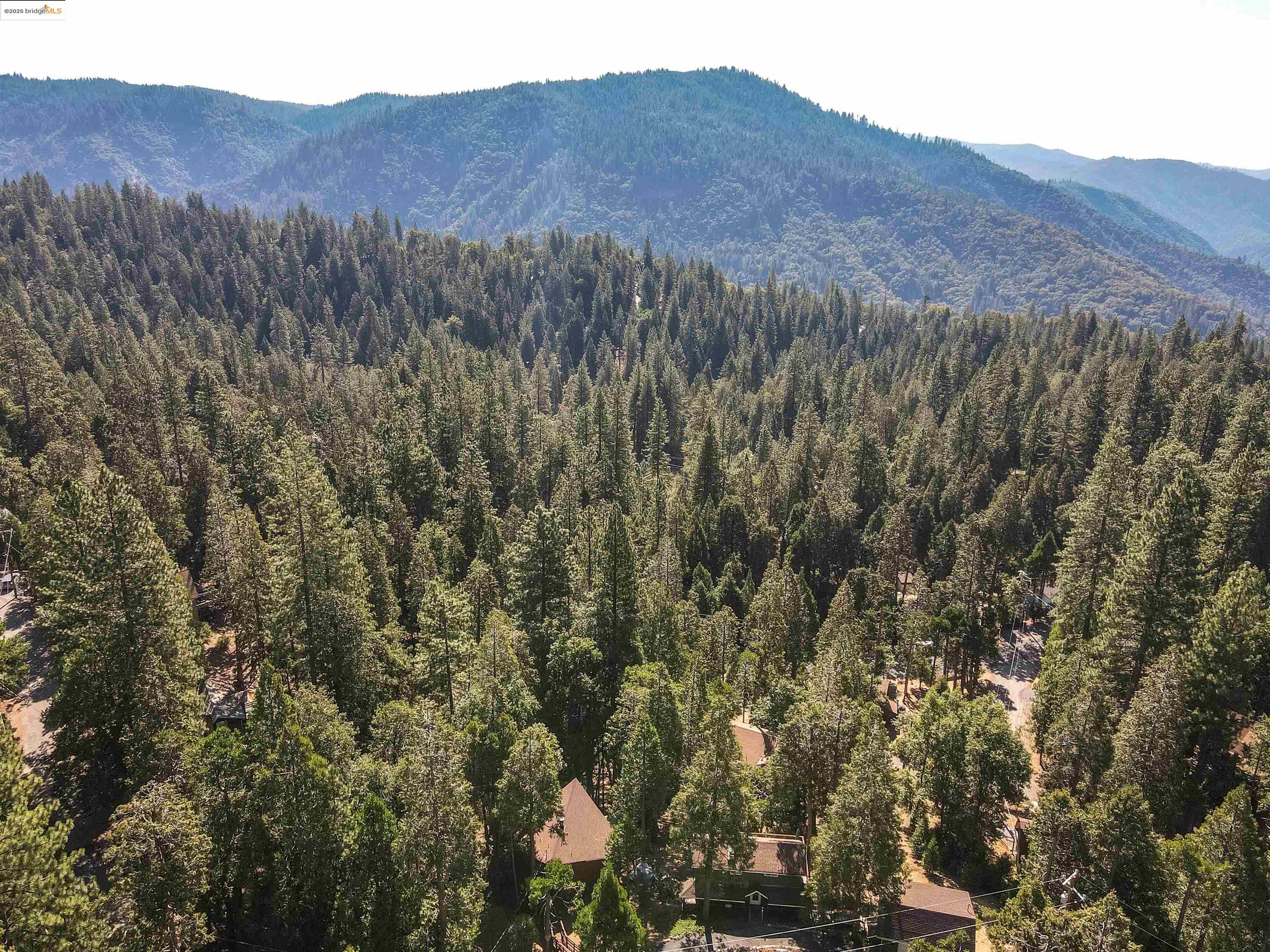 20737 Muheli Road Mi Wuk Village, CA 95346 - Photo 40 of 40 a view of a lush green hillside and a building