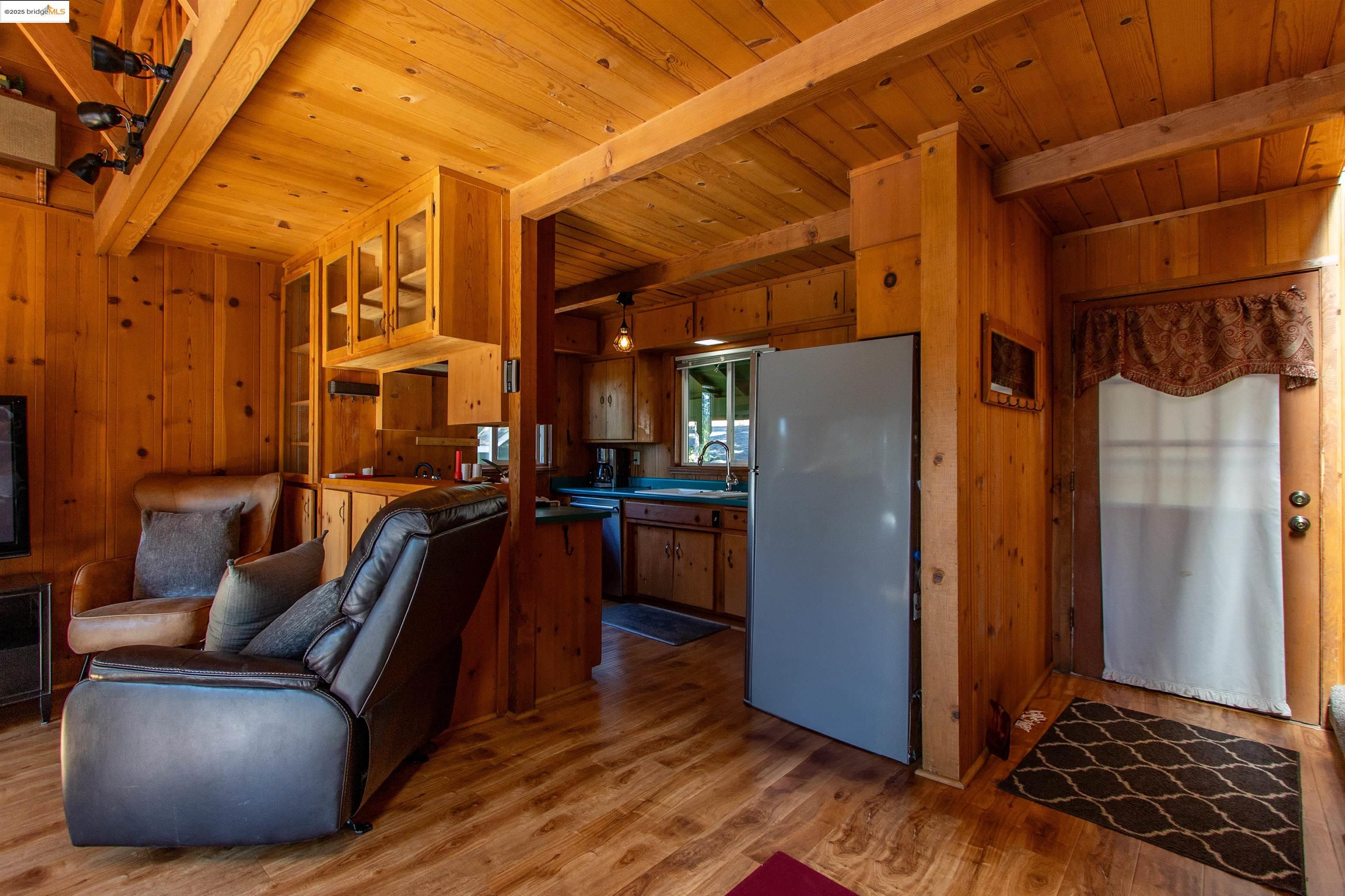 20737 Muheli Road Mi Wuk Village, CA 95346 - Photo 10 of 40 a view of a living room with a balcony