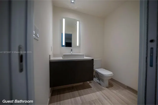 a bathroom with a double vanity sink and mirror