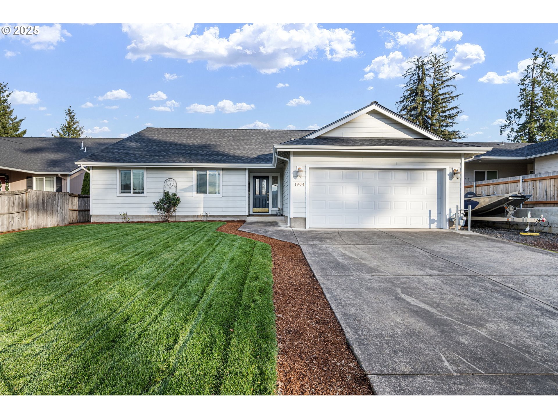 1904 South 6th Street Cottage Grove, OR 97424 - Photo 1 of 37 a front view of a house with a yard and potted plants