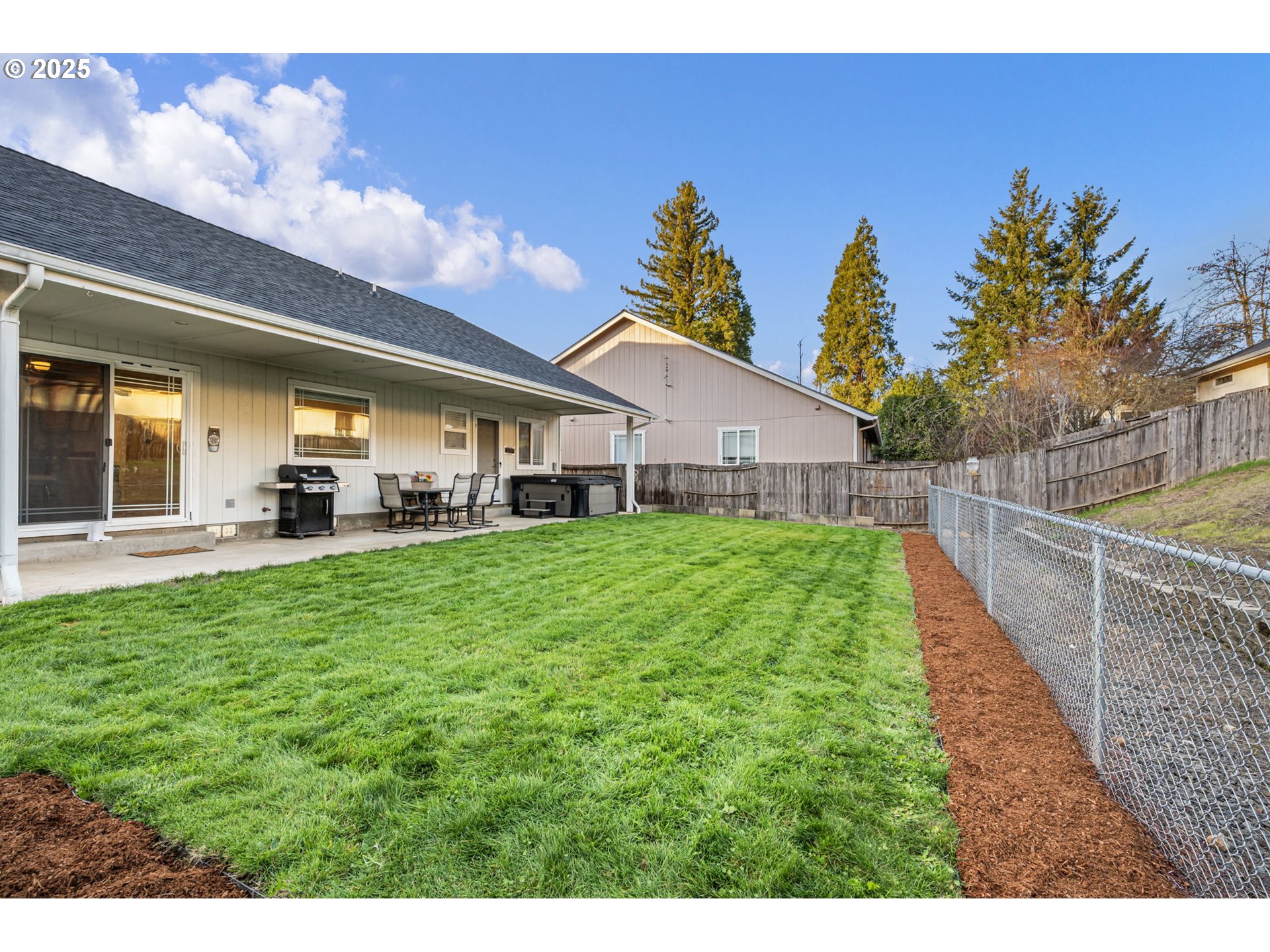 1904 South 6th Street Cottage Grove, OR 97424 - Photo 18 of 37 a view of a house with a yard