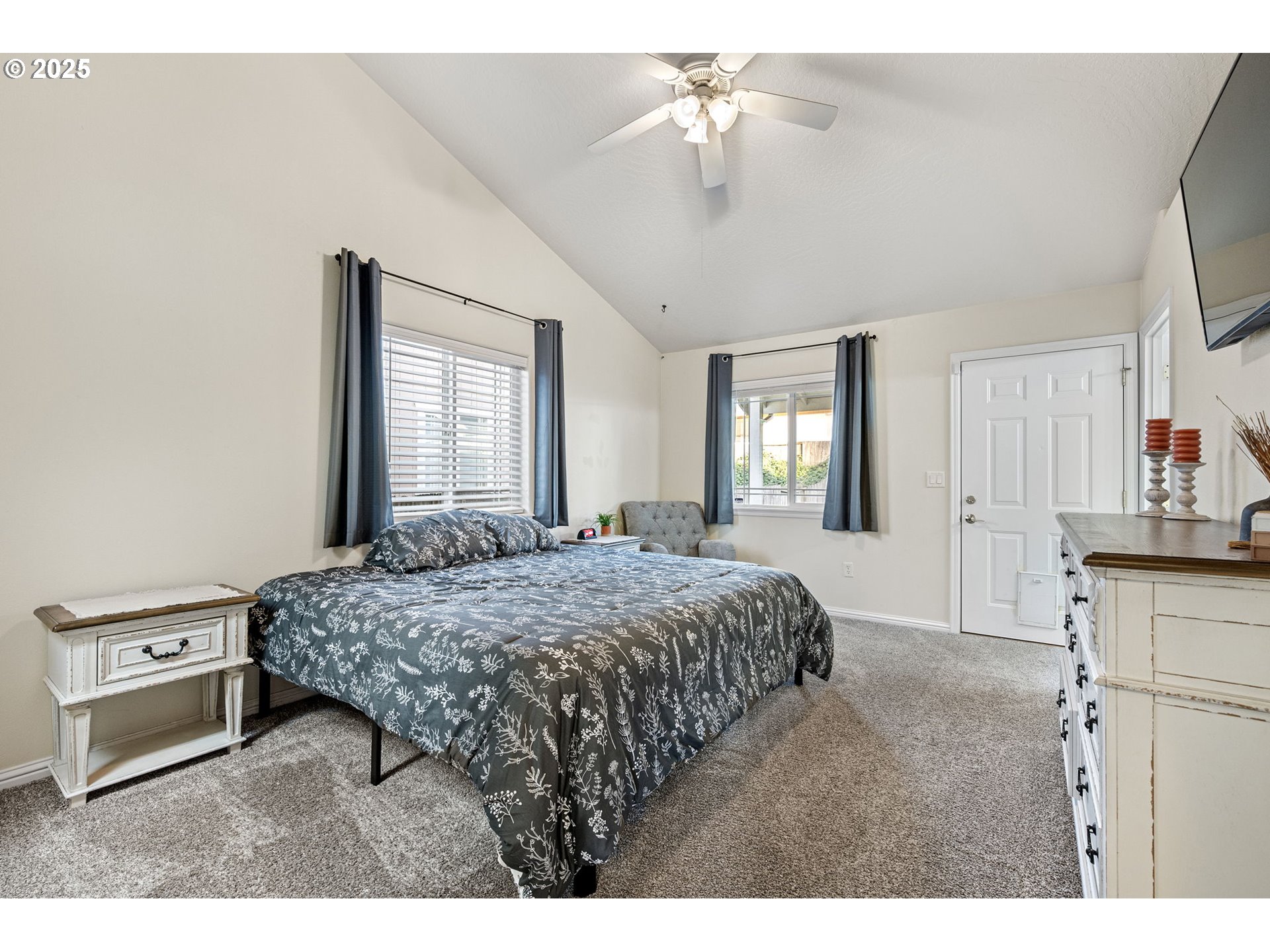 1904 South 6th Street Cottage Grove, OR 97424 - Photo 23 of 37 a bedroom with a bed and a chandelier