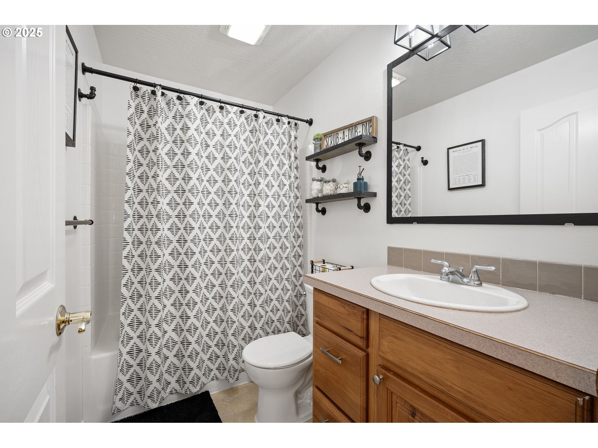 1904 South 6th Street Cottage Grove, OR 97424 - Photo 30 of 37 a bathroom with a sink and a mirror