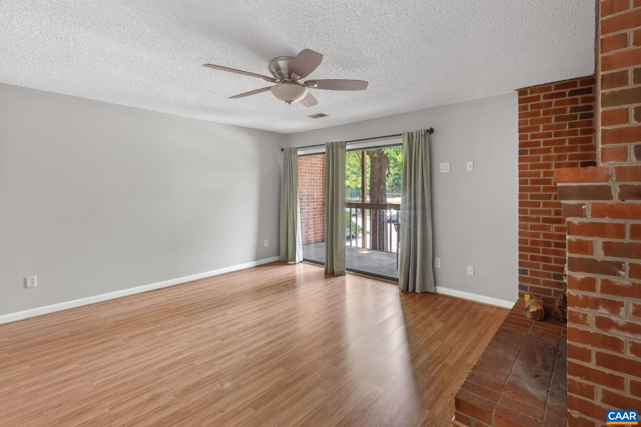 103 Turtle Creek Road, Unit 8 Charlottesville, VA 22901 - Photo 5 of 37 wooden floor in an empty room with a window