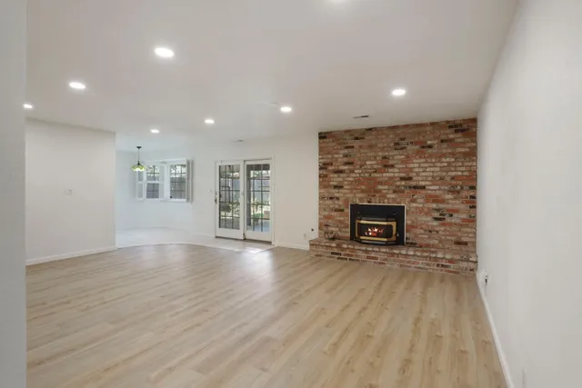 a room with window and chandelier