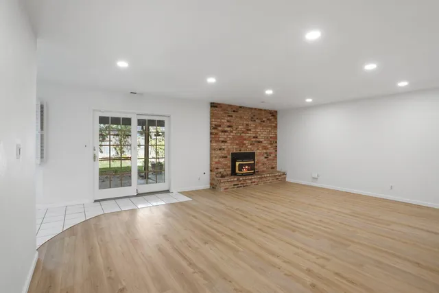 a kitchen with white cabinets appliances and sink