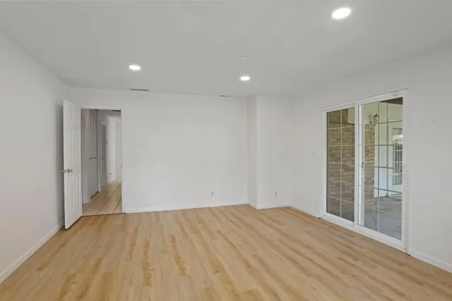 a bathroom with a sink shower and a mirror