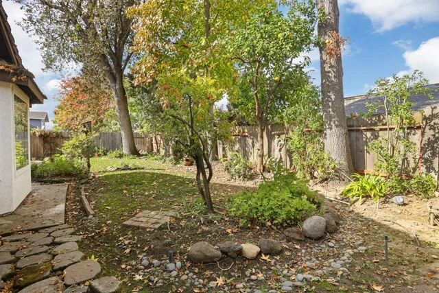 a backyard of a house with lots of green space