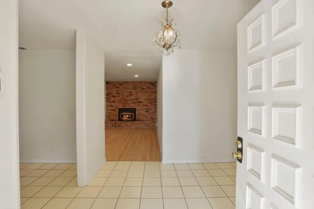 a view of an empty room with glass door